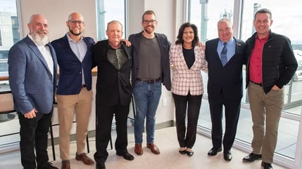 Senior leaders gathered at the Welcome Home Celebration at The Kith Condominiums in Erin Mills, Mississauga. Photo by: Arthur Mola Standing left to right: Don Pugh, Partner, The Daniels Corporation, Jake Cohen, President, The Daniels Corporation, Keith Tansley, Executive Director, Community Living Mississauga, Adam Hagedorn, Principal, Portfolio Management, BGO, Nina Tangri, Member of Provincial Parliament, Mississauga-Streetsville, Brad Butt, Ward 11 Councillor, City of Mississauga, Chris Beesley, Chief Executive Offer, Community Living Ontario.